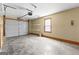 Garage with a large door and shelving offering ample storage space at 180 Lagrange Ct, Fayetteville, GA 30214