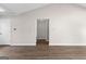 Hallway with neutral paint, updated floors, and access to multiple rooms at 180 Lagrange Ct, Fayetteville, GA 30214