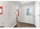 Hallway with neutral paint, modern floors, and access to other rooms at 180 Lagrange Ct, Fayetteville, GA 30214