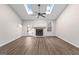 Bright living room with vaulted ceilings, fireplace, and door to the backyard at 180 Lagrange Ct, Fayetteville, GA 30214