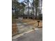 Ranch style home with attached garage and mature trees at 20 Pond Ct, Stockbridge, GA 30281