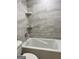 Bathroom with a bathtub and tile surround at 62 Haver Dr, Riverdale, GA 30274