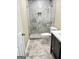 Updated bathroom with a walk-in shower and tile flooring at 62 Haver Dr, Riverdale, GA 30274