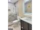 Modern bathroom with a double vanity, shower, and toilet at 62 Haver Dr, Riverdale, GA 30274