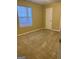 Spacious bedroom with carpeted floors and large window at 62 Haver Dr, Riverdale, GA 30274