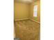 Simple bedroom with neutral walls and carpet at 62 Haver Dr, Riverdale, GA 30274