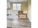 Dining area with wood-look flooring and large window at 62 Haver Dr, Riverdale, GA 30274