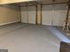 Two-car garage with painted floor at 62 Haver Dr, Riverdale, GA 30274