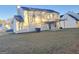 Two-story house with backyard patio, covered porch, and partial view of a neighbor's house at 62 Haver Dr, Riverdale, GA 30274