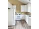 Modern kitchen with white cabinets and new appliances at 62 Haver Dr, Riverdale, GA 30274