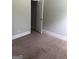 Neutral bedroom with an open closet and plush carpeting creates a comfortable and inviting space at 284 Madison Grace Ave, Mcdonough, GA 30252