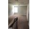 Upstairs bonus room with neutral carpet and natural light at 284 Madison Grace Ave, Mcdonough, GA 30252