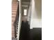 Entryway features hardwood flooring, stairs to the upper level, and detailed wainscoting at 284 Madison Grace Ave, Mcdonough, GA 30252