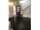 Elegant foyer with hardwood flooring, and stairs leading to the second floor at 284 Madison Grace Ave, Mcdonough, GA 30252