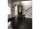 Welcoming foyer with hardwood floors and decorative trim with stairs leading to the second floor at 284 Madison Grace Ave, Mcdonough, GA 30252