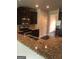Stylish kitchen features dark wood cabinetry, stainless steel appliances, and granite countertops at 284 Madison Grace Ave, Mcdonough, GA 30252