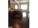 Open kitchen shows granite countertops, stainless steel appliances, and hardwood flooring at 284 Madison Grace Ave, Mcdonough, GA 30252