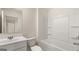 Bathroom featuring a combined shower and bathtub with a white sink and toilet combo at 321 Sound Cir # 138, Stockbridge, GA 30281