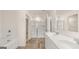 Bathroom featuring double sinks, large shower, soaking tub, and modern fixtures at 321 Sound Cir # 138, Stockbridge, GA 30281