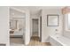 Bright bathroom adjoining bedroom featuring a soaking tub, closet and view to bedroom at 321 Sound Cir # 138, Stockbridge, GA 30281