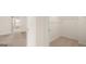 This bedroom features carpeted floors and a walk-in closet, located next to another bedroom at 321 Sound Cir # 138, Stockbridge, GA 30281