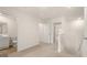 Upstairs hallway with carpeted floors and doors to a bathroom and additional rooms at 321 Sound Cir # 138, Stockbridge, GA 30281