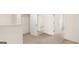 Upstairs hallway features carpeted floors, multiple doors, and a wire rack in the closet at 321 Sound Cir # 138, Stockbridge, GA 30281