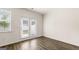 Bright room featuring wood floors, neutral walls, and a window with natural light at 321 Sound Cir # 138, Stockbridge, GA 30281