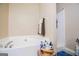 Bright bathroom with a tub, shower and towel rack, ideal for relaxation at 1391 Lakeview Pkwy, Villa Rica, GA 30180