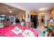 View of a dining room adjacent to the kitchen, featuring a table with red linens at 1391 Lakeview Pkwy, Villa Rica, GA 30180