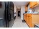 Bright kitchen with wood cabinets and black appliances at 1391 Lakeview Pkwy, Villa Rica, GA 30180