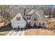 Two-story house with stone accents and a two-car garage, aerial view at 106 Old Gettysburg Way, Dallas, GA 30157