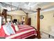 Bright bedroom with a four-poster bed and access to the bathroom at 106 Old Gettysburg Way, Dallas, GA 30157