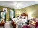 Charming bedroom with a queen-size bed and sitting area at 106 Old Gettysburg Way, Dallas, GA 30157