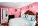 Bright bedroom with a queen-size bed and walk-in closet at 106 Old Gettysburg Way, Dallas, GA 30157