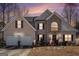 Two-story house with stone accents and a two-car garage at 106 Old Gettysburg Way, Dallas, GA 30157