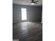 Bright bedroom with ceiling fan and vinyl plank flooring at 1059 Garibaldi Sw St, Atlanta, GA 30310