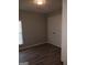 Simple bedroom with grey wood-look flooring and double door closet at 1059 Garibaldi Sw St, Atlanta, GA 30310