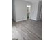 Spacious bedroom with access to bathroom and vinyl plank flooring at 1059 Garibaldi Sw St, Atlanta, GA 30310