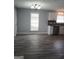 Bright dining area with wood-look flooring and modern light fixture at 1059 Garibaldi Sw St, Atlanta, GA 30310