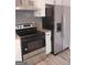 Stainless steel range and refrigerator in a modern kitchen setting at 1059 Garibaldi Sw St, Atlanta, GA 30310