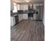 Modern kitchen with white cabinets, granite countertops, and stainless steel appliances at 1059 Garibaldi Sw St, Atlanta, GA 30310