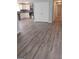 Modern kitchen featuring stainless steel appliances and grey wood-look flooring at 1059 Garibaldi Sw St, Atlanta, GA 30310