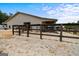Large metal barn with adjacent fenced pastures at 3170 Double Bridges Rd, Rutledge, GA 30663