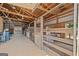 Barn interior showcasing multiple stalls with wooden gates, providing secure housing for animals at 3170 Double Bridges Rd, Rutledge, GA 30663