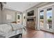 Main bedroom with fireplace, hardwood floors, and patio access at 3170 Double Bridges Rd, Rutledge, GA 30663