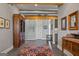 Elegant entryway with hardwood floors and antique furniture at 3170 Double Bridges Rd, Rutledge, GA 30663