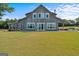 Gray barn style home with a large yard and porch at 3170 Double Bridges Rd, Rutledge, GA 30663