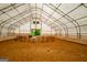 Indoor riding arena with sand footing and round pen at 3170 Double Bridges Rd, Rutledge, GA 30663