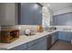 Modern kitchen with gray cabinets, quartz countertops, and stainless steel appliances at 3170 Double Bridges Rd, Rutledge, GA 30663